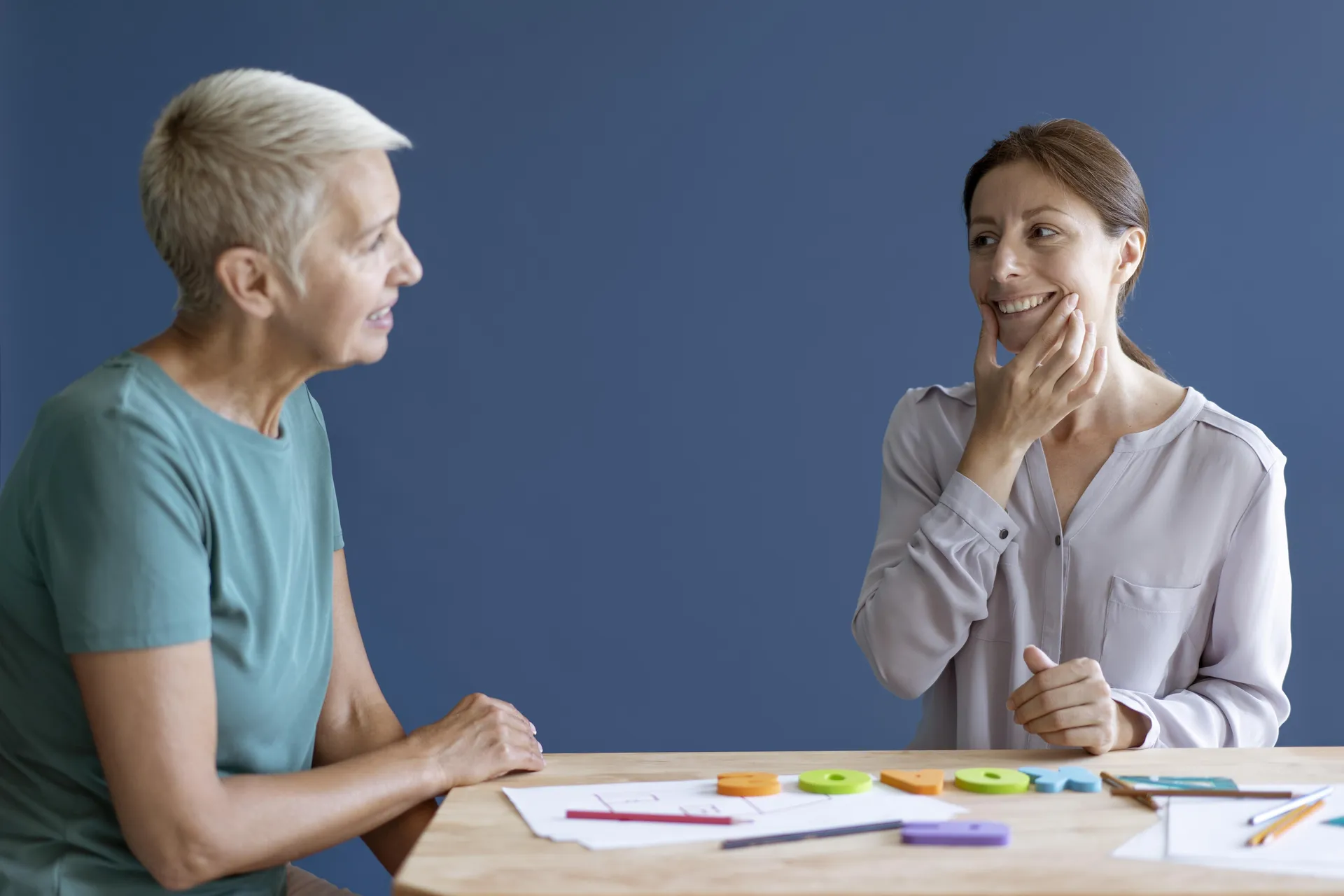Family members receiving training to support adult communication therapy at home