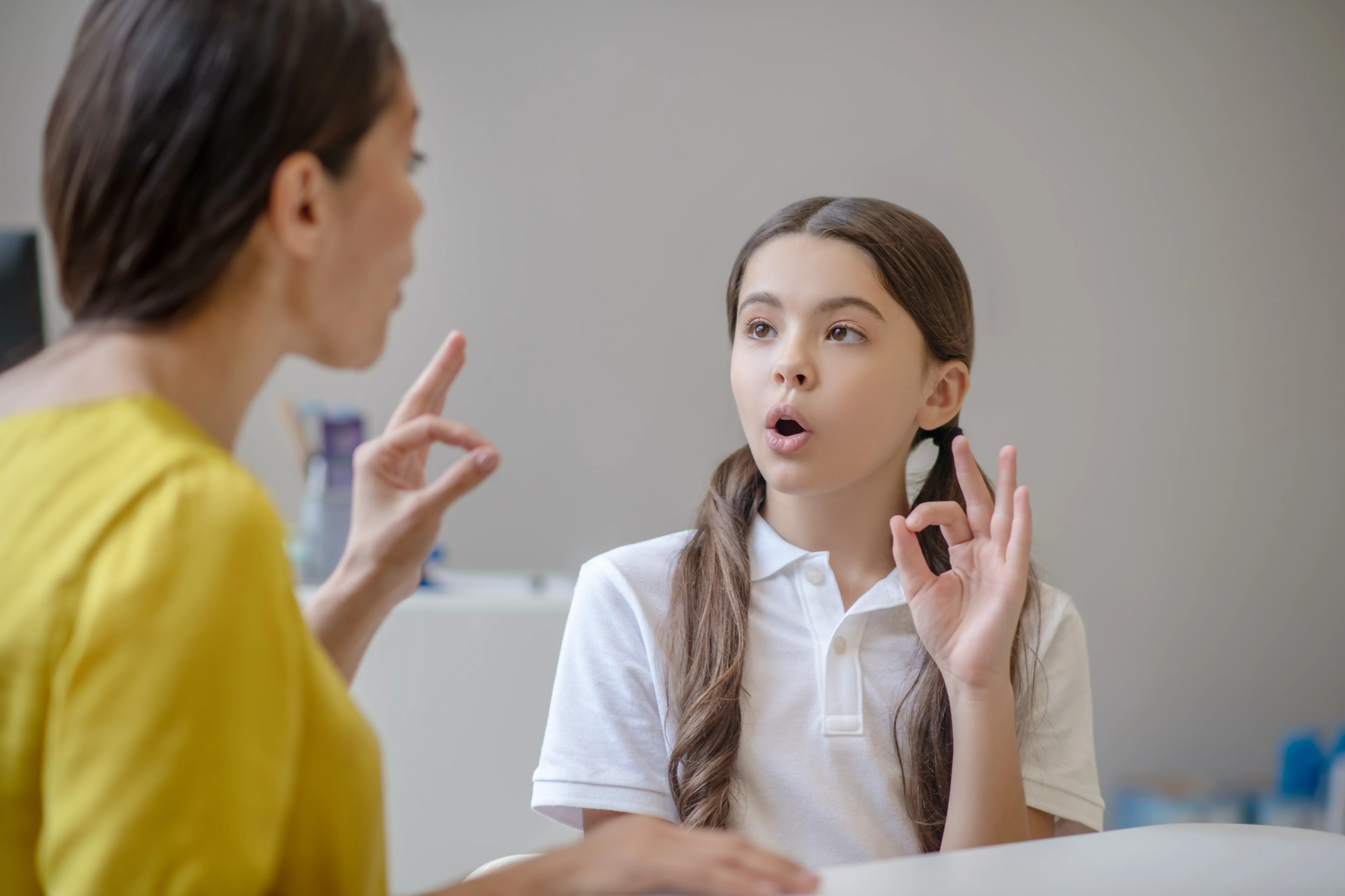 Family receiving clear explanation of evaluation results and next steps from speech therapist