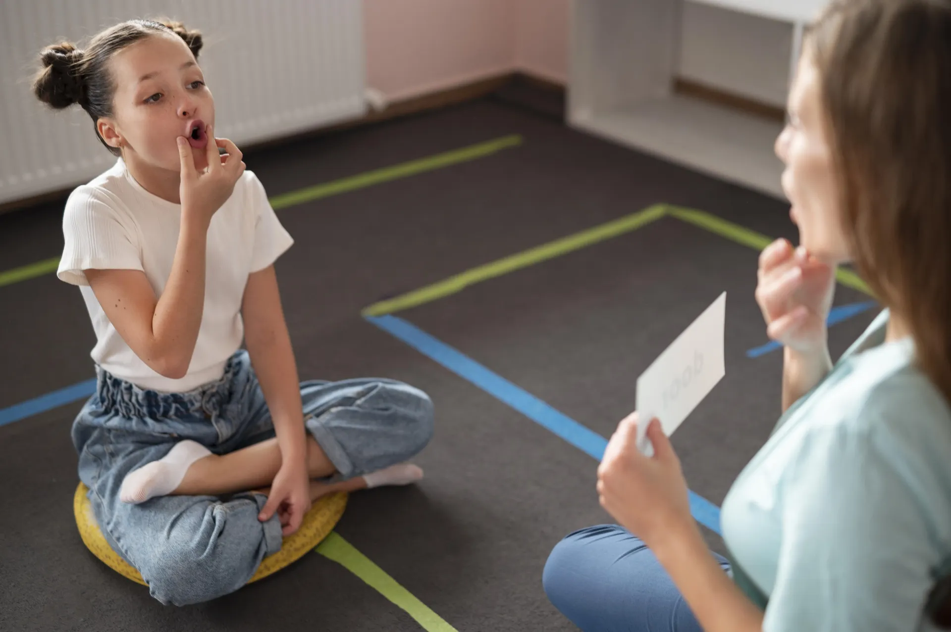 Child demonstrating improved academic performance and classroom participation after speech therapy