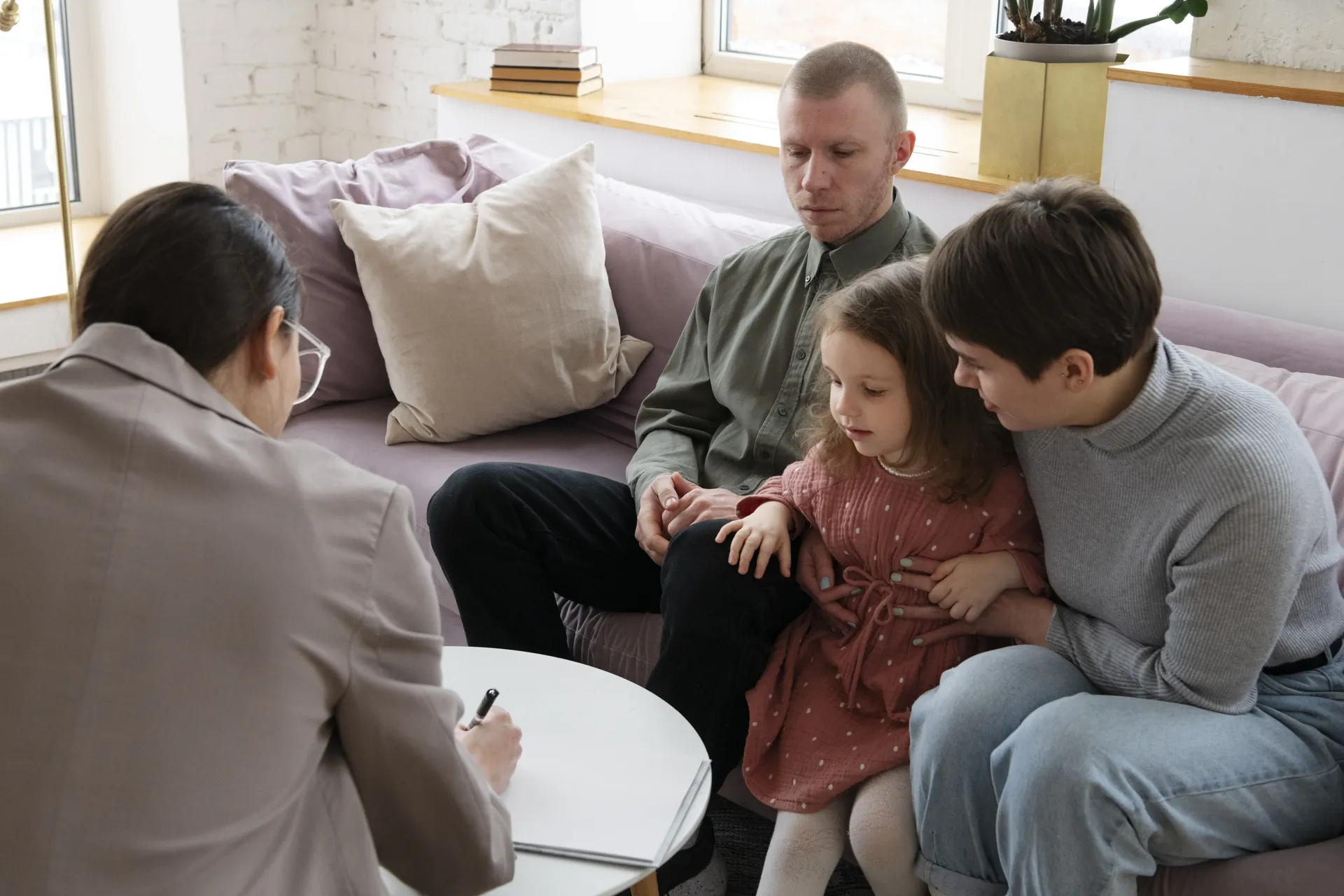 Family participating in virtual therapy training session